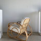 Large rattan rest chair and white cushions