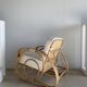 Large rattan rest chair and white cushions