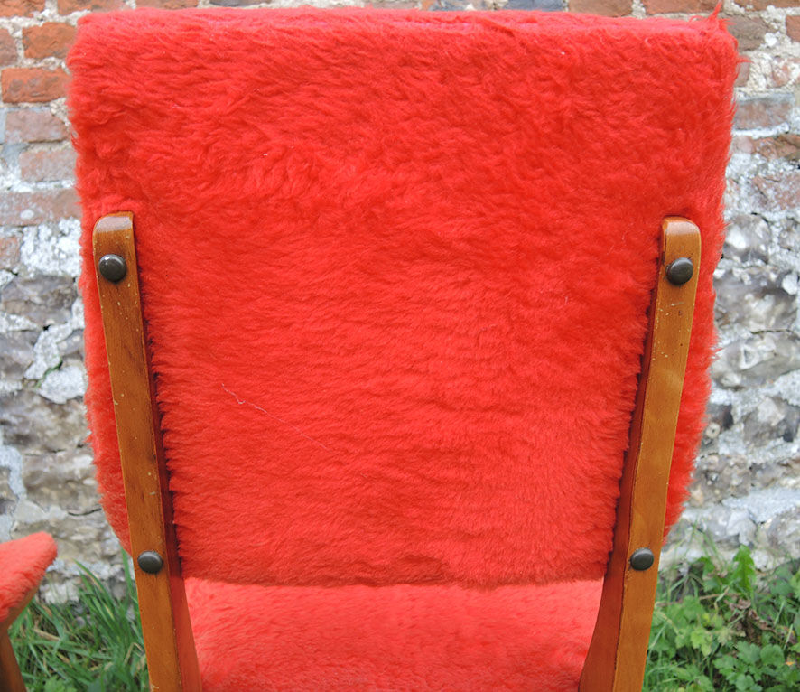 2 old red 'moumoute' chairs