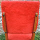 2 old red 'moumoute' chairs