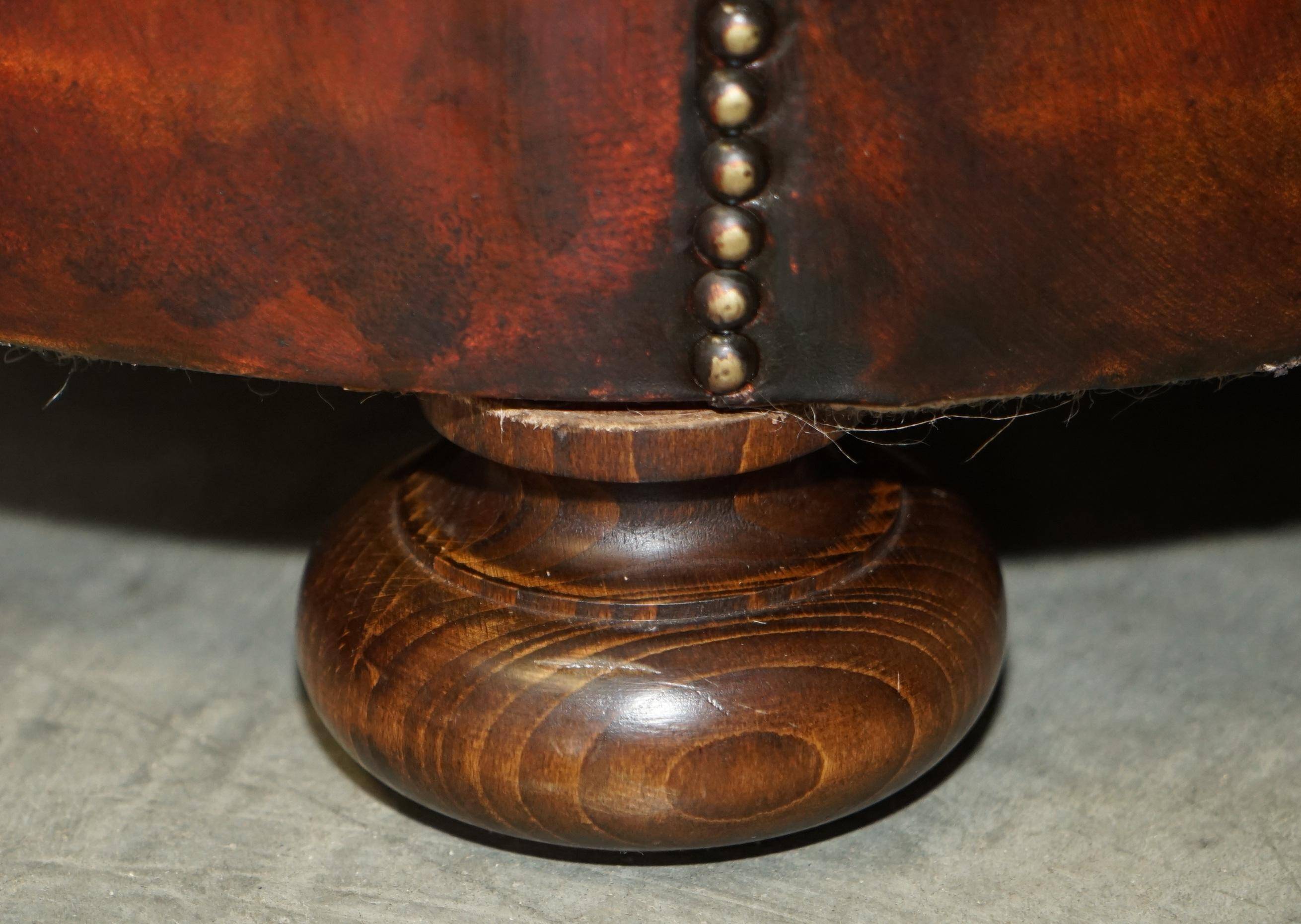 Pair of restored antique Chesterfield sofas in Boudreaux leather.