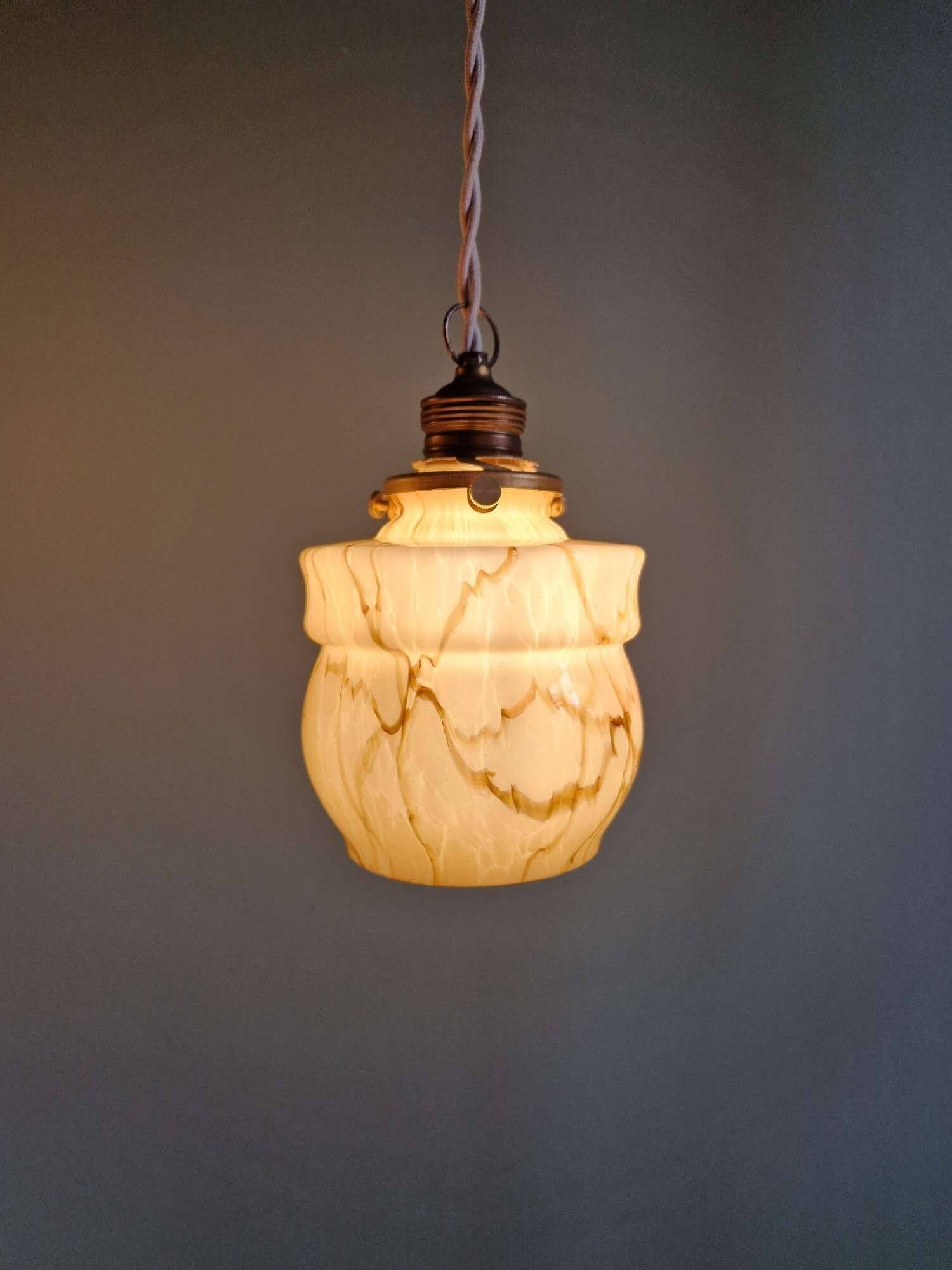 Art Deco trio of suspensions in opaline and marbled ouraline, Scailmont, 1920-30.