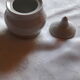 Set of 4 small covered pots in white porcelain