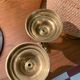 Pair of 19th-century brass pusher candlesticks