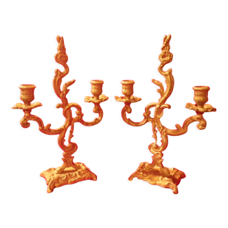 Two brass NCIAN candlesticks