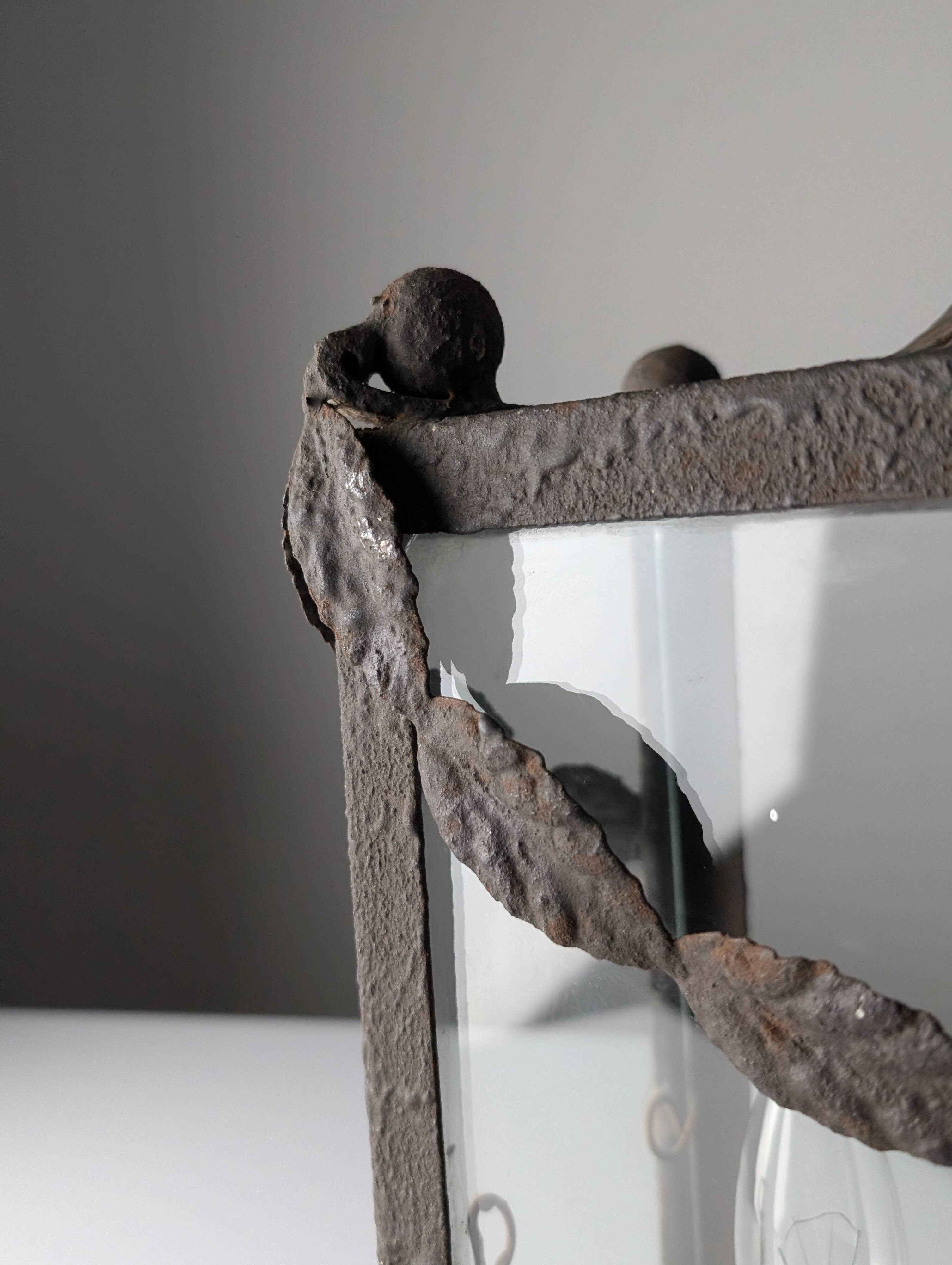 Wrought iron lantern with glass panels, leaf motifs