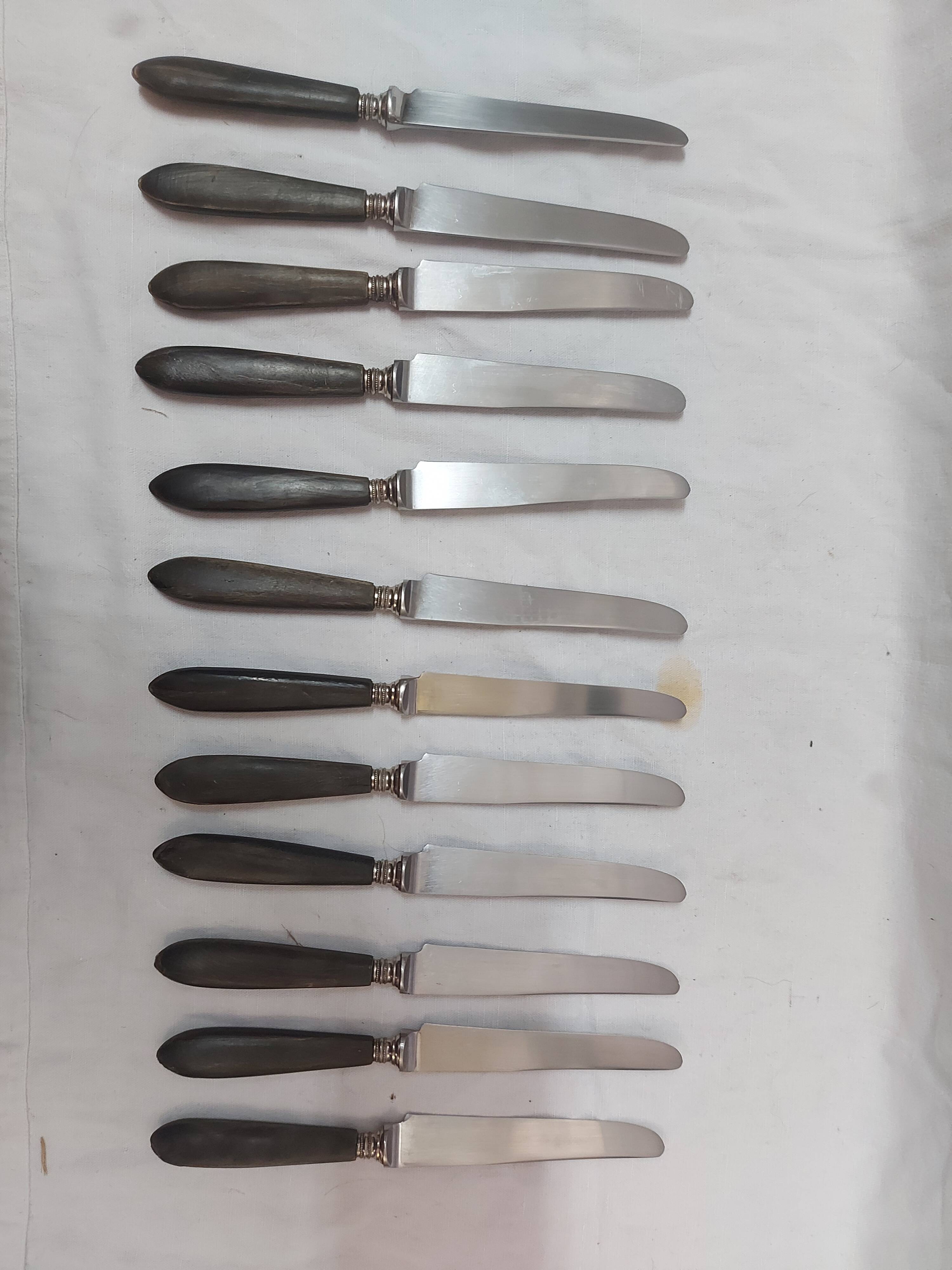 12 ebony handled knives, 1950