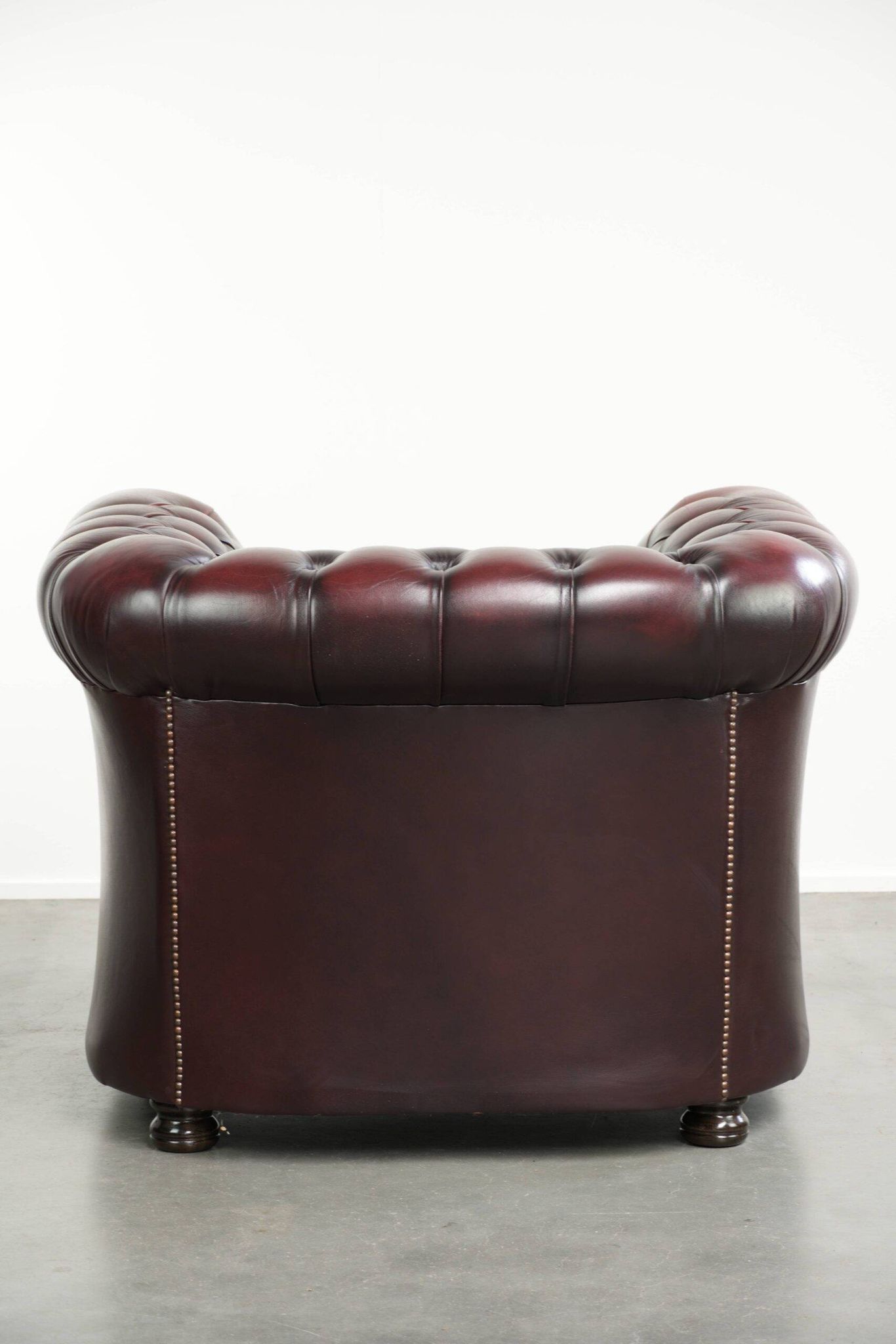 English cowhide Chesterfield club armchair in a beautiful red colour