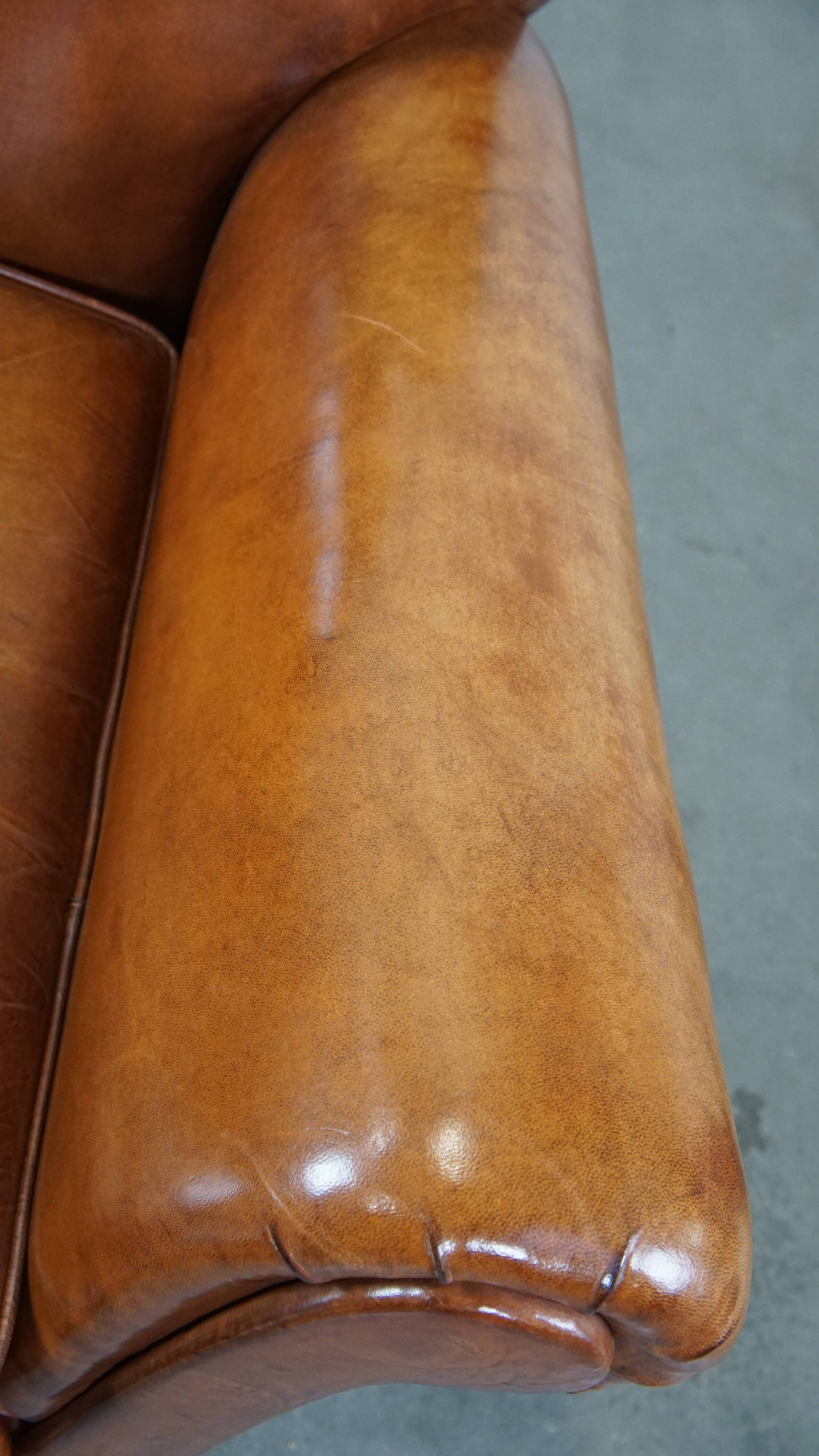 Cognac-colored antique sheep leather armchair