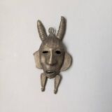 Handcrafted bronze wall mask, Sénoufo African art.