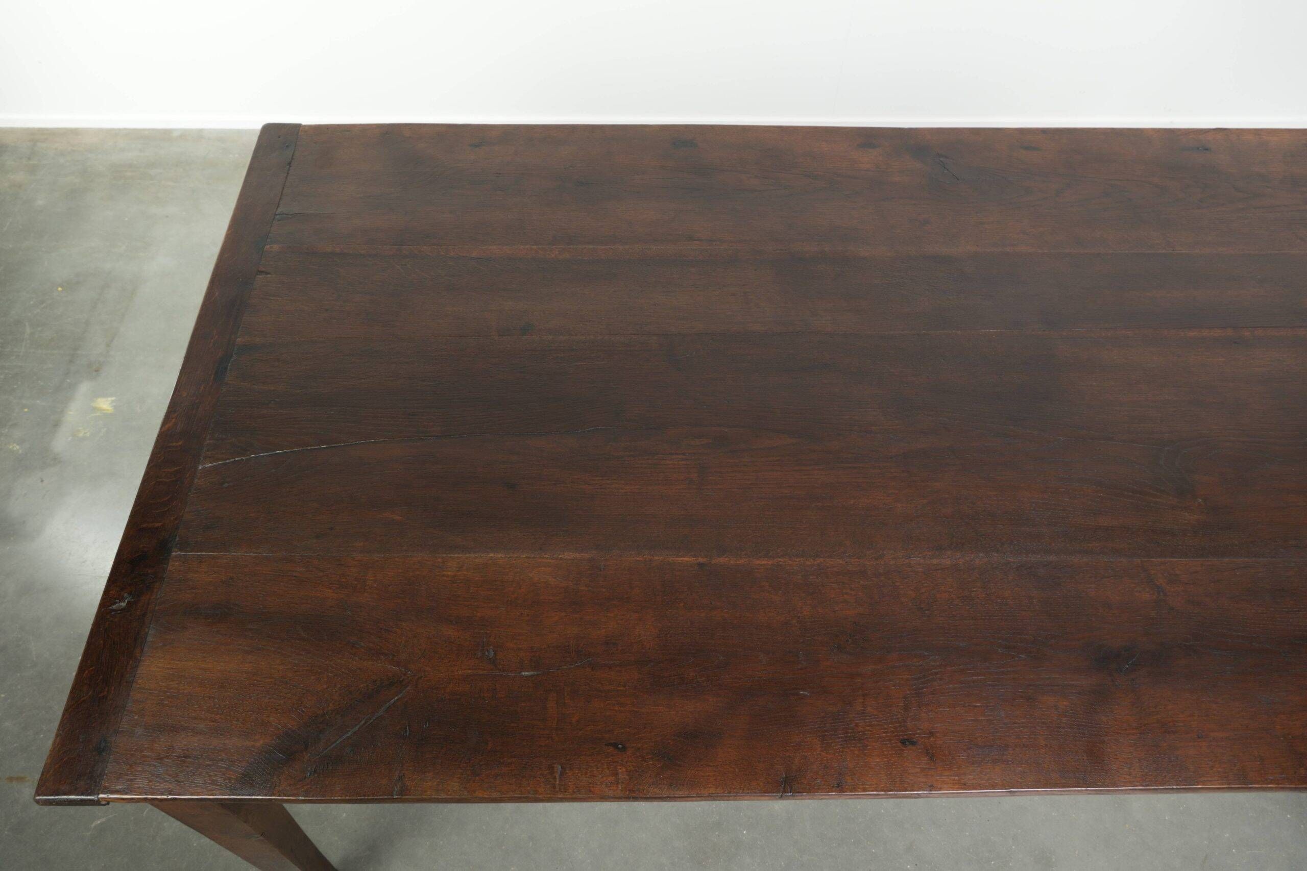 Antique French oak dining table from the early 19th century
