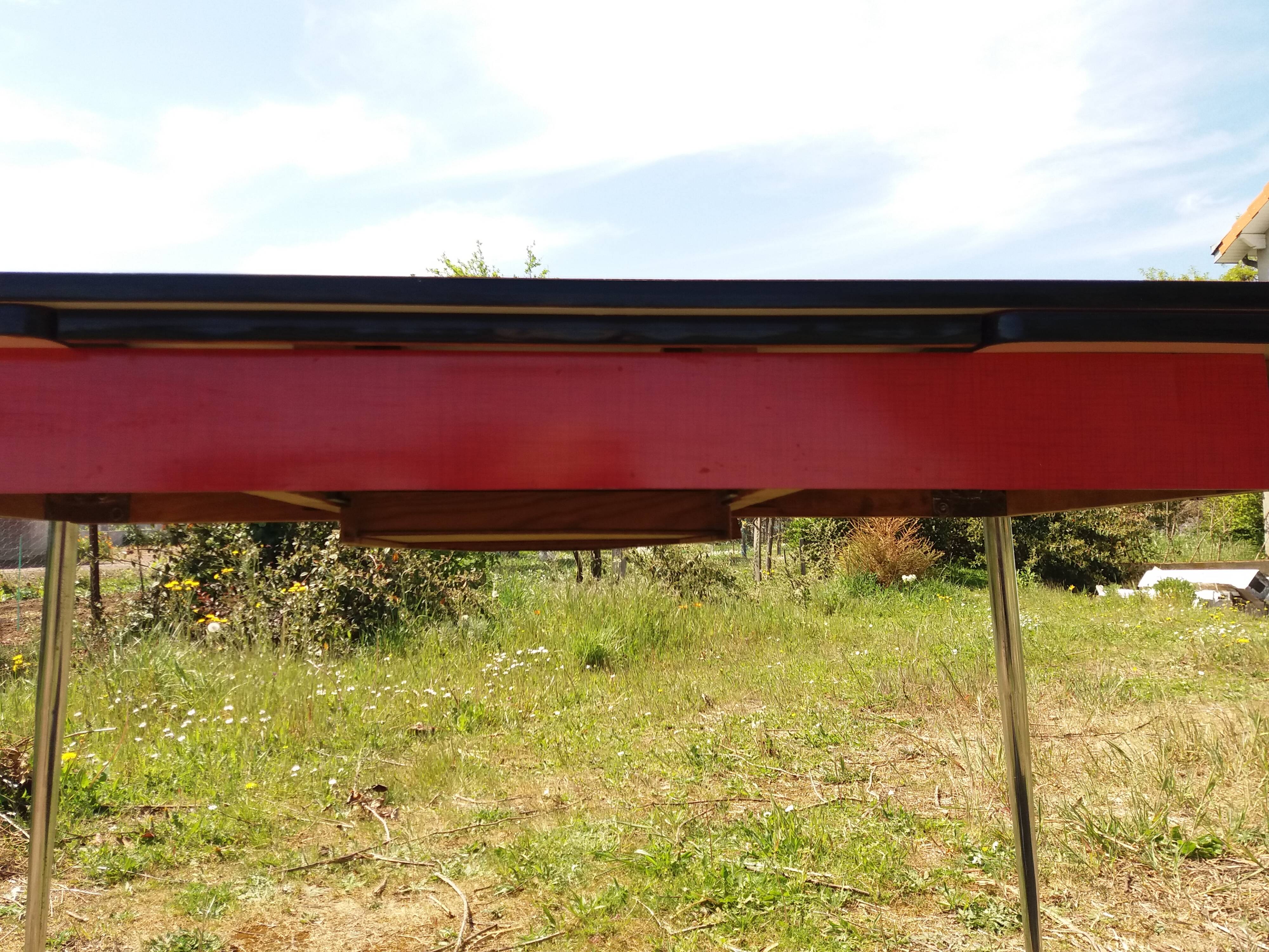 Dining table with red formica extensions