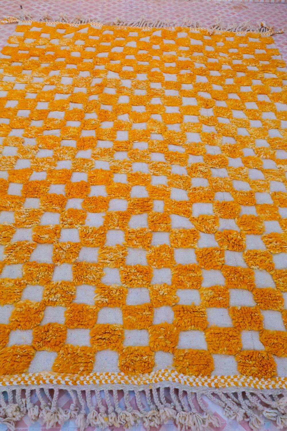 Yellow and white checkered Berber rug
