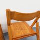 Pair of vintage folding chairs in pine from the 70s and 80s.