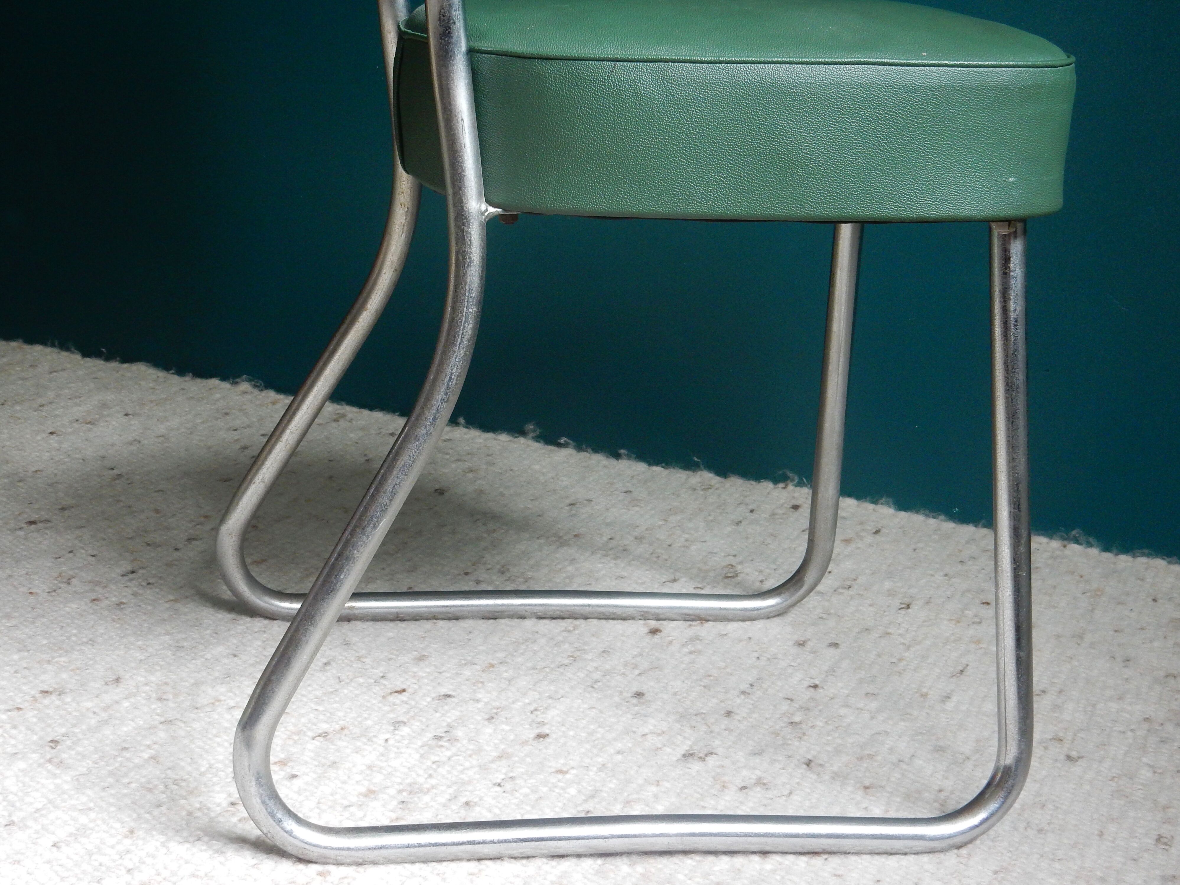 Office chair in green skaï