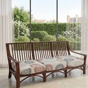 Vintage salon Maison Maugrion in rattan with leather and feather finishes.