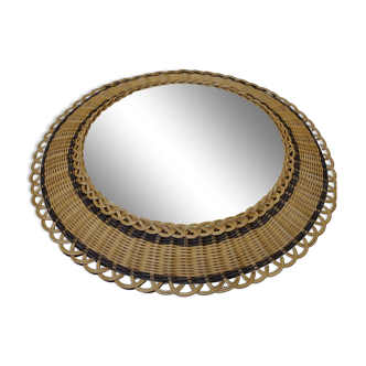 Vintage round mirror in a wicker frame