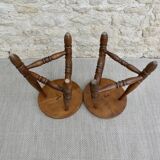 Pair of solid wood tripod stools, carved.