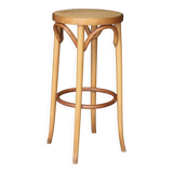Beautiful caned stool in curved blond wood. 1940s/1950s