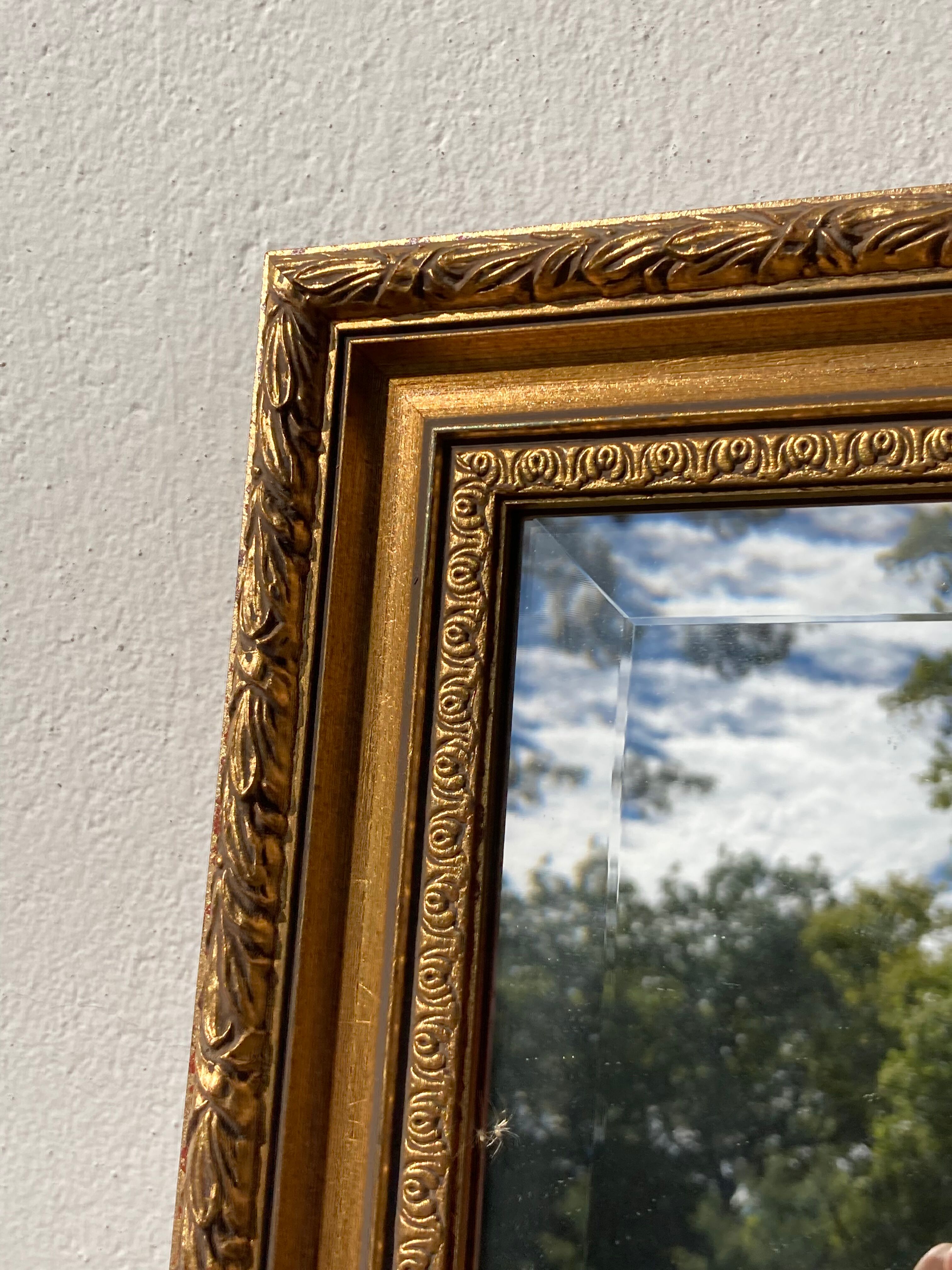 Antique mirror in rectangular beveled gilded wood in Louis XVI style