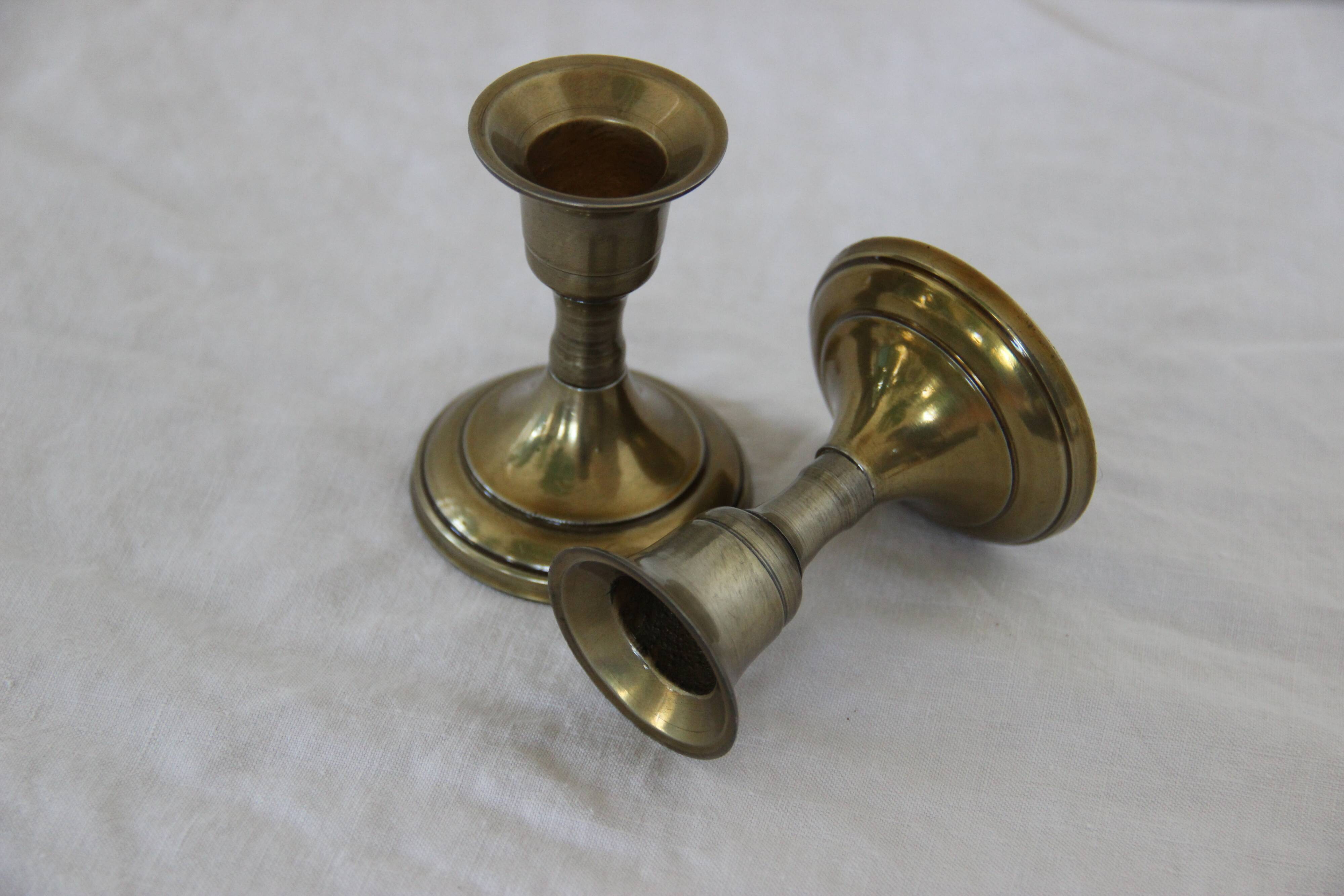 Small golden metal candle holders