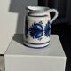 Artisan blue floral decorative carafe, height 17 cm, diameter 24.5 cm.