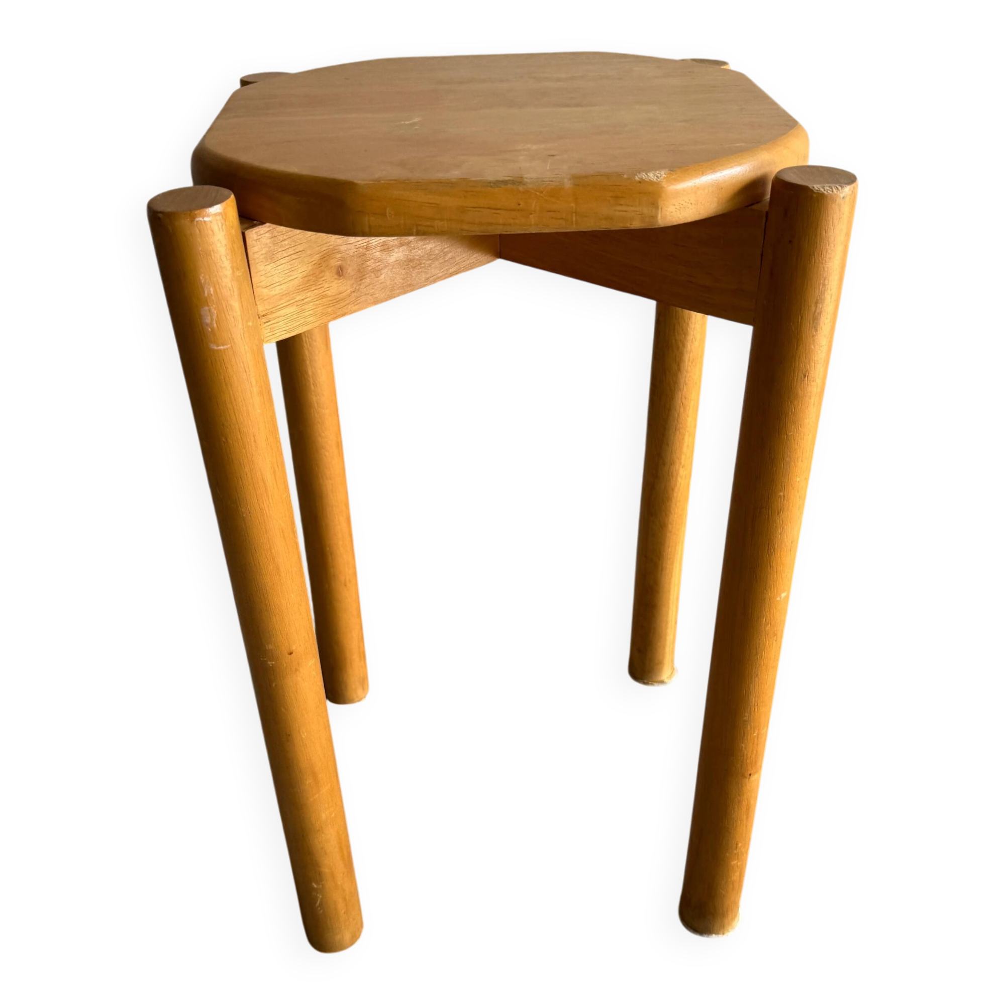 Vintage solid wood stool with an organic-shaped seat.