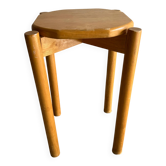 Vintage solid wood stool with an organic-shaped seat.