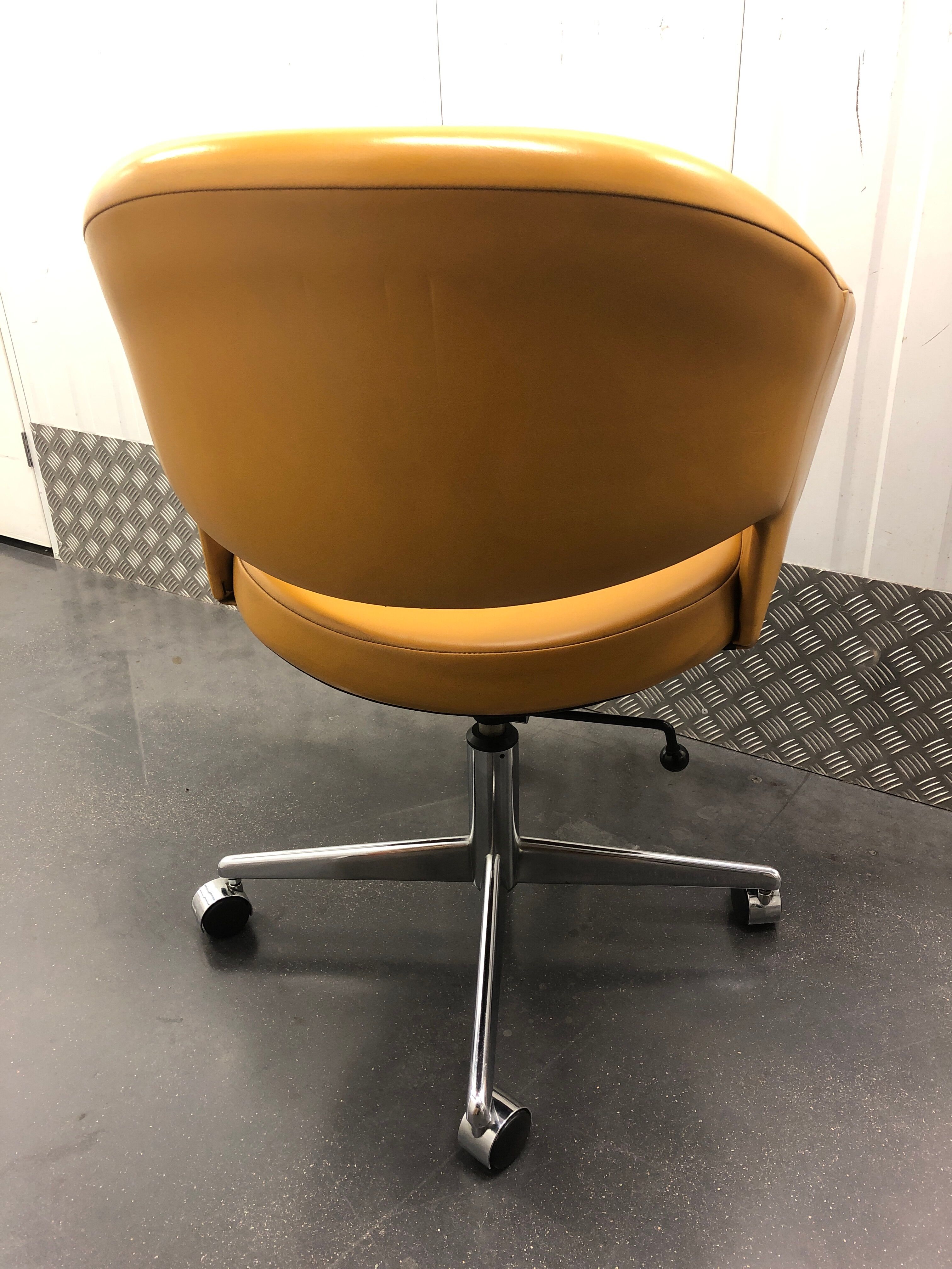 Vintage office chair in mustard yellow skai circa 1960