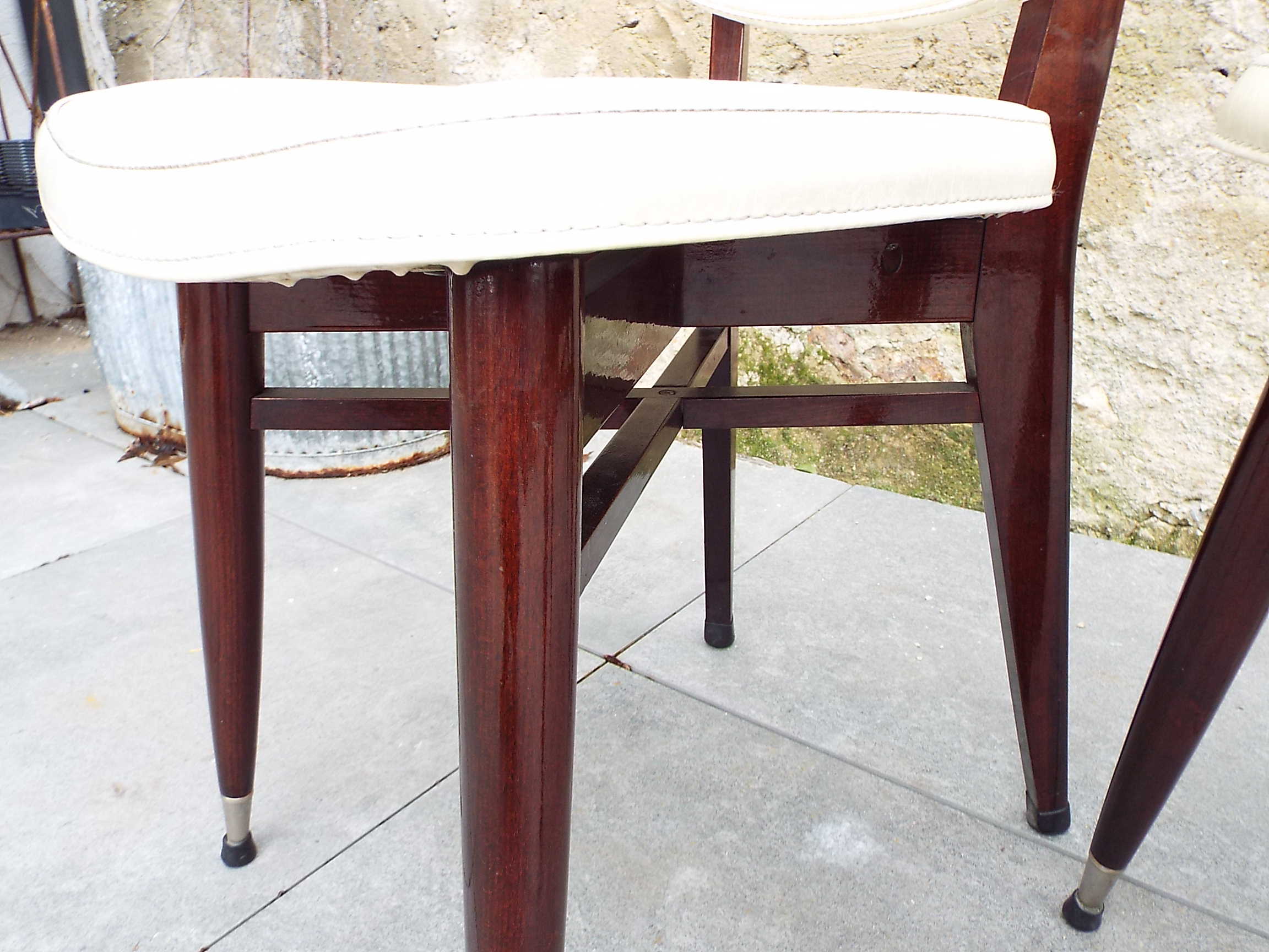 2 skai and wooden chairs