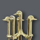 Antique fireplace tool in gilded zamak with duck head designs.