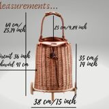 Wicker basket on wheels with leather flap