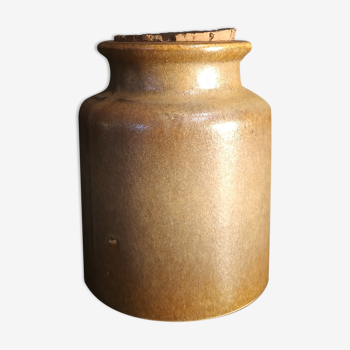 Old mustard pot in sandstone