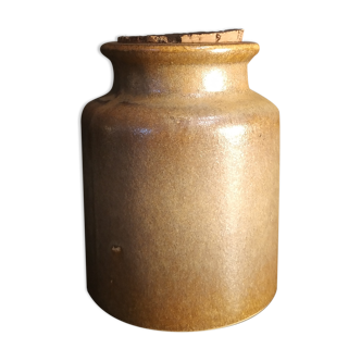 Old mustard pot in sandstone