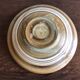 Ceramic dish of the 2 potters with decoration in concentric circles in shades of yellow, brown and white