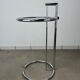 Chrome and glass design side table, adjustable.