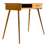 Vintage desk with tapered legs.