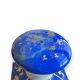 Perfume bottle in porcelain of old paris blue background