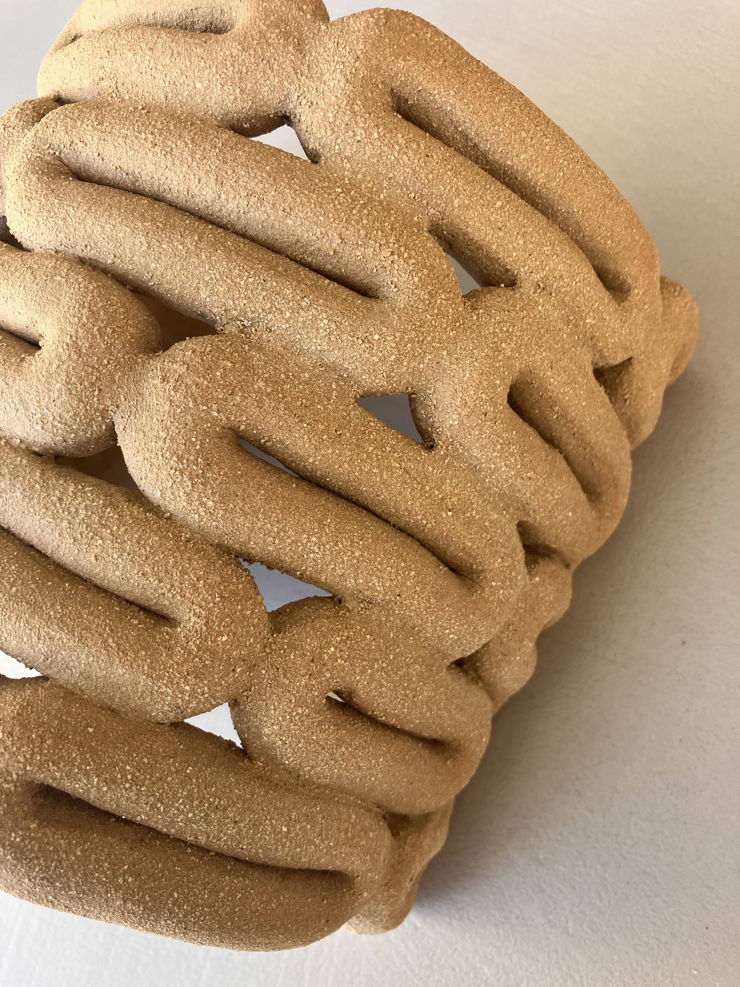 Handcrafted ceramic wall light in raw stoneware inspired by Mid Century design.