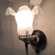 Art Deco wall light in brass with glass shade - mid 20th century.