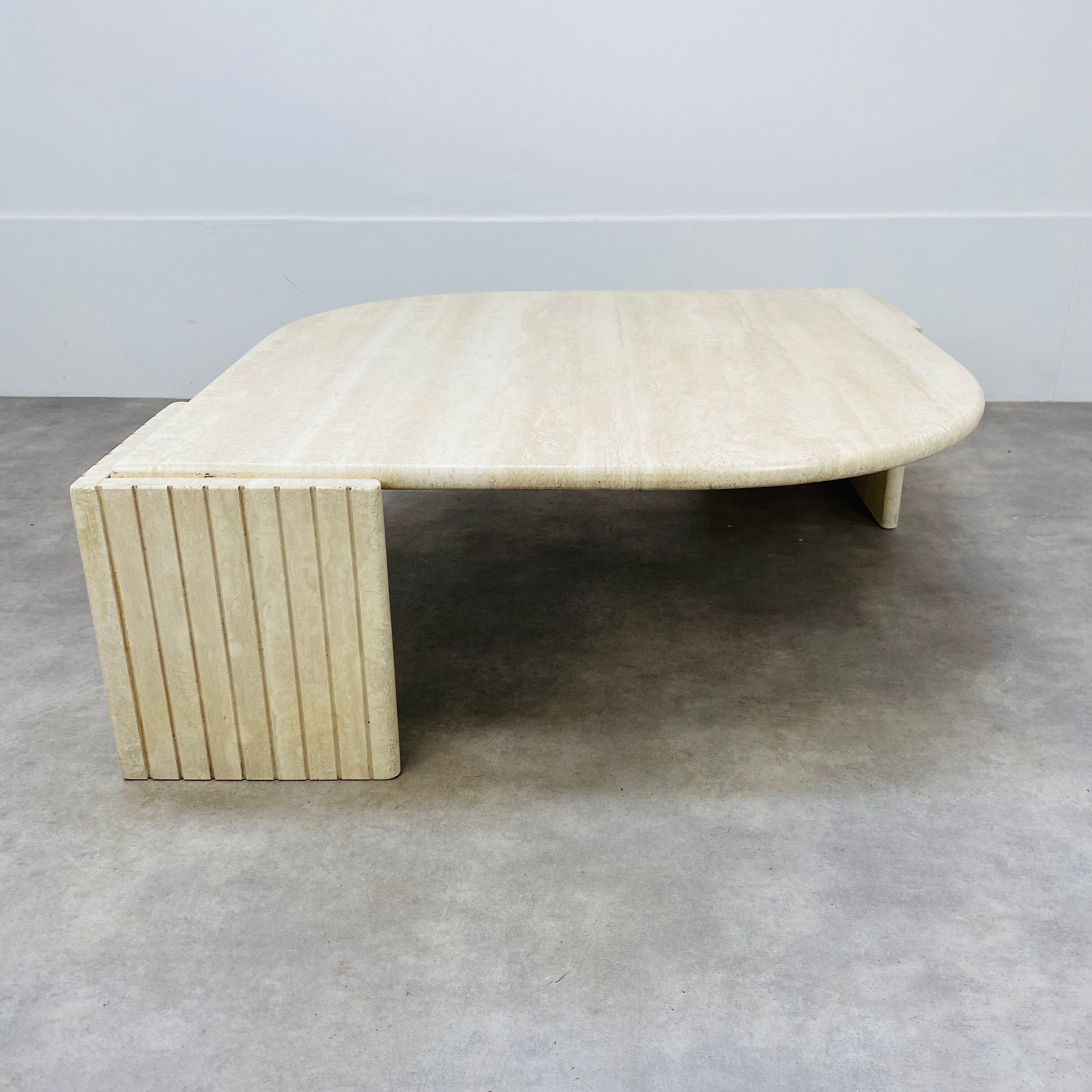 Travertine eye coffee table Roche Bobois