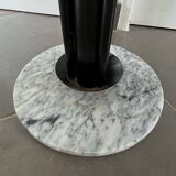 Black metal parrot coat rack on marble base