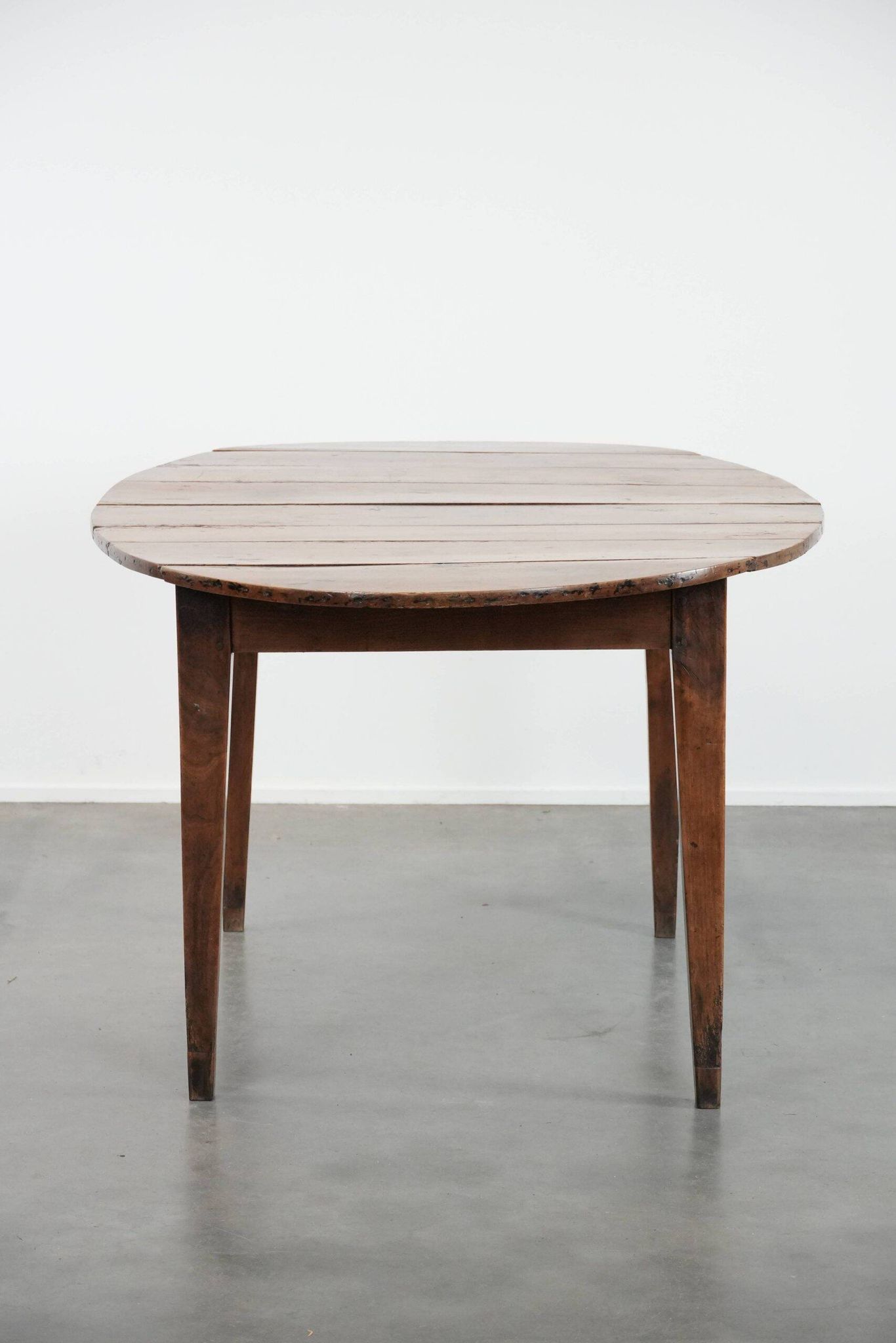 Rare antique oval French extendable dining table made of fruitwood