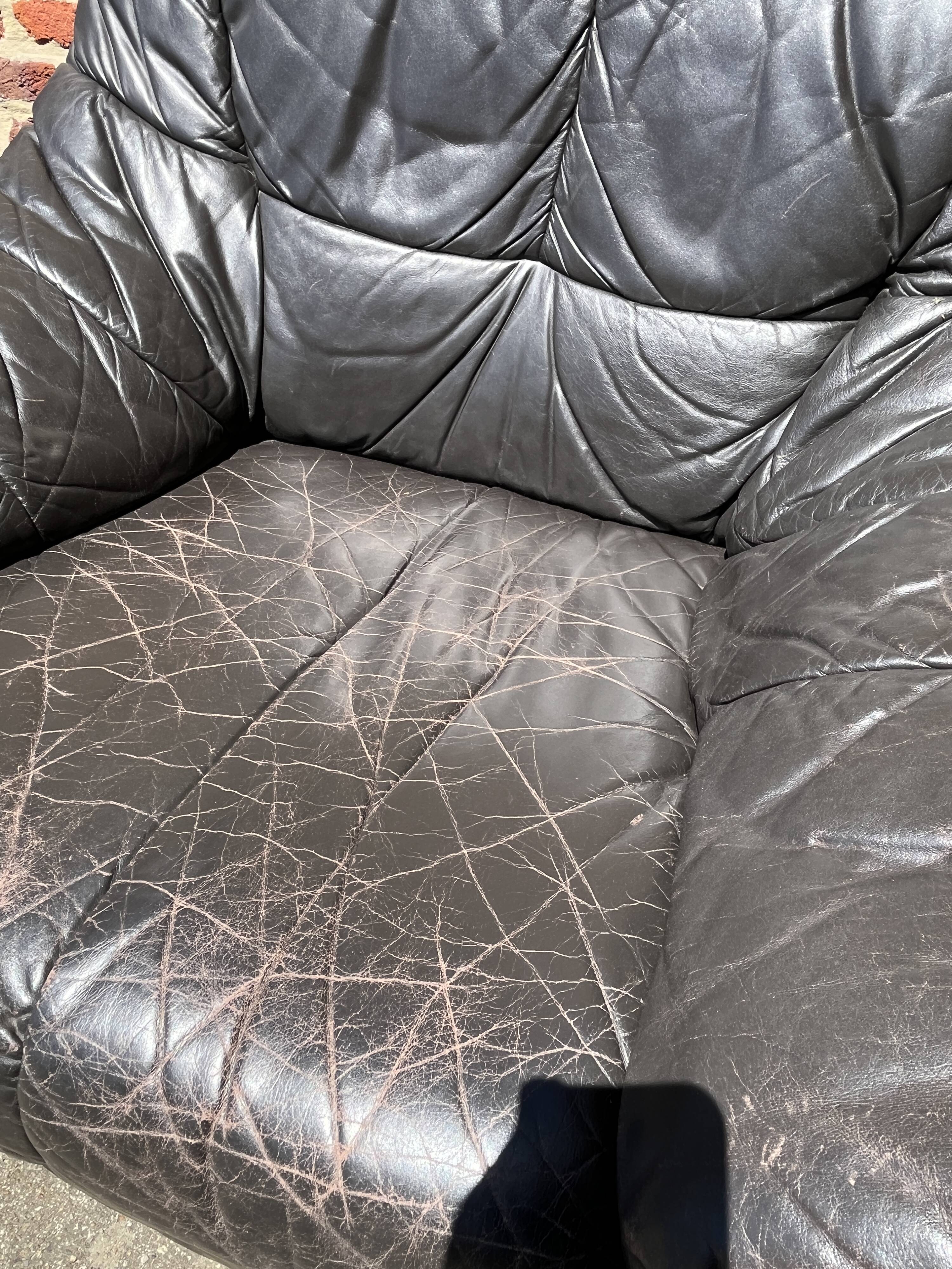 Pair of patinated leather club armchairs