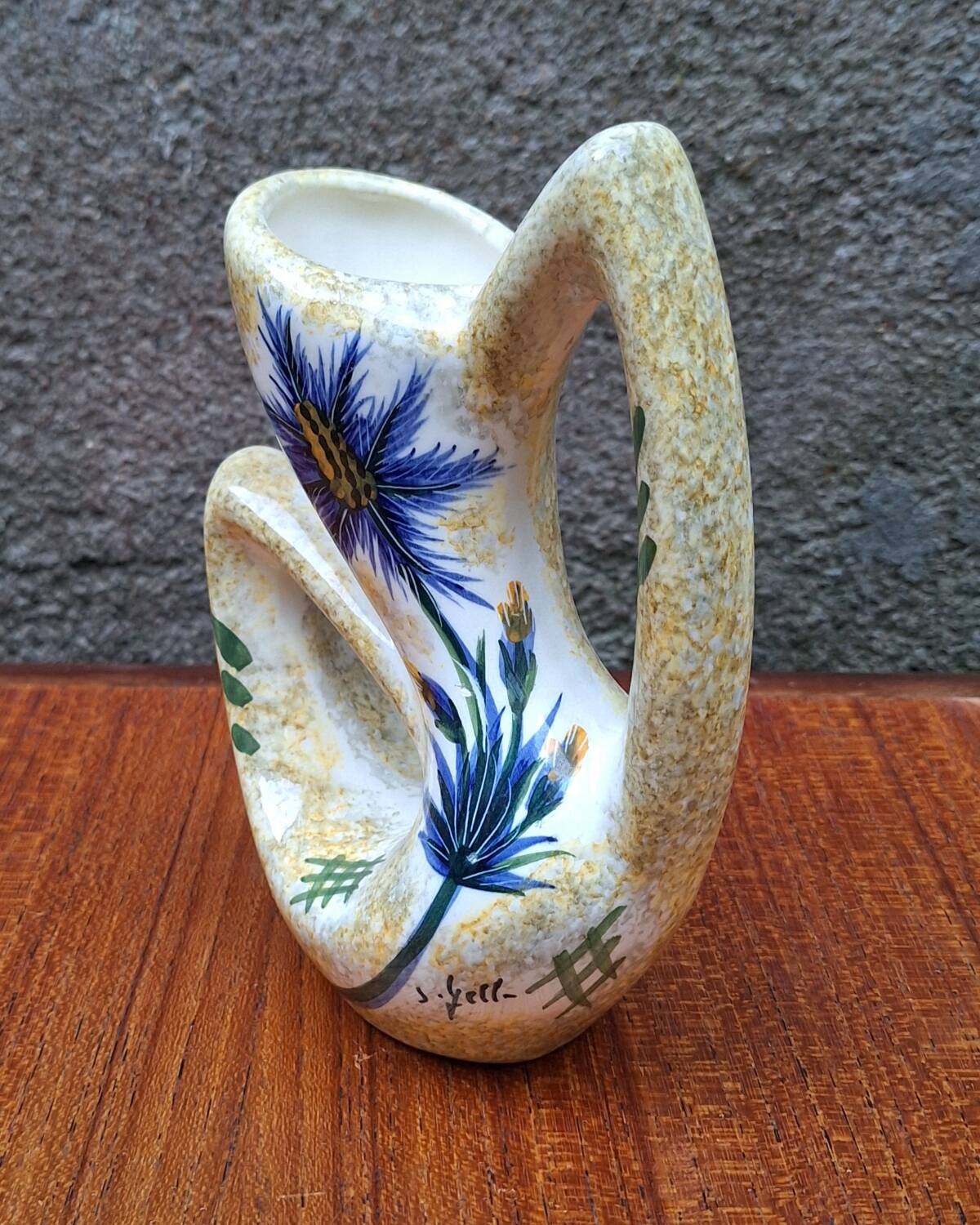 Earthenware vase signed by Jacqueline Gelb with a thistle decoration.