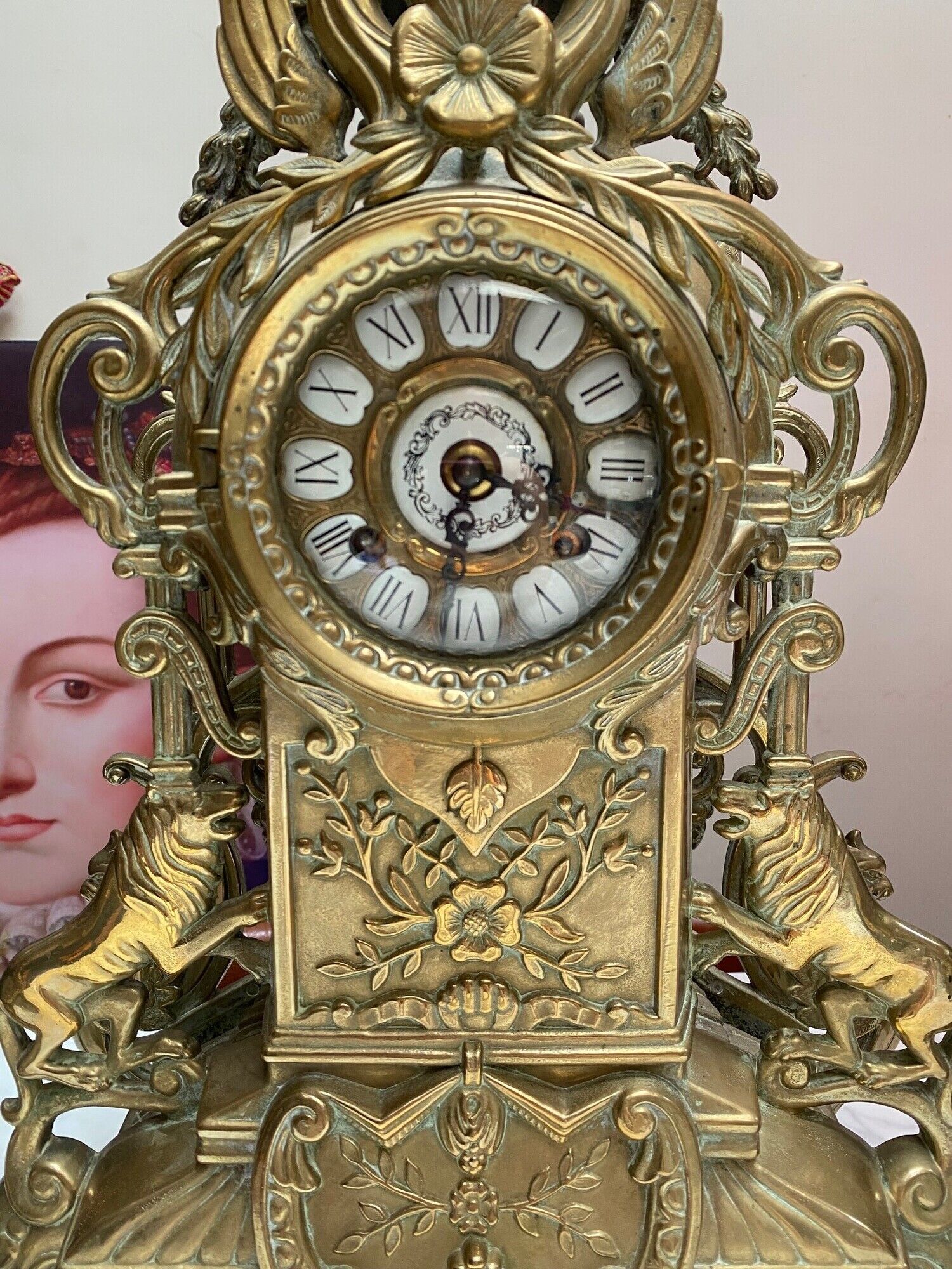 Fireplace trim clock and adornment of antique bronze candelabra