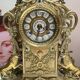 Fireplace trim clock and adornment of antique bronze candelabra