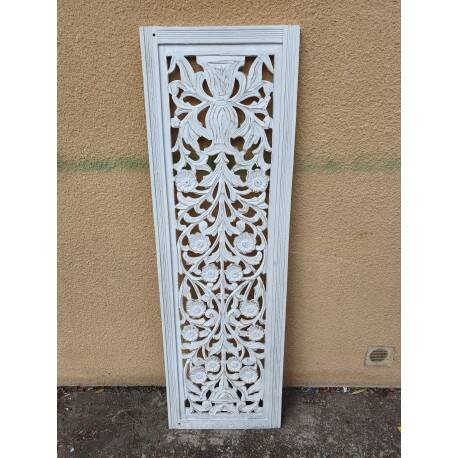 Decorative wooden panel with carved and openwork design.