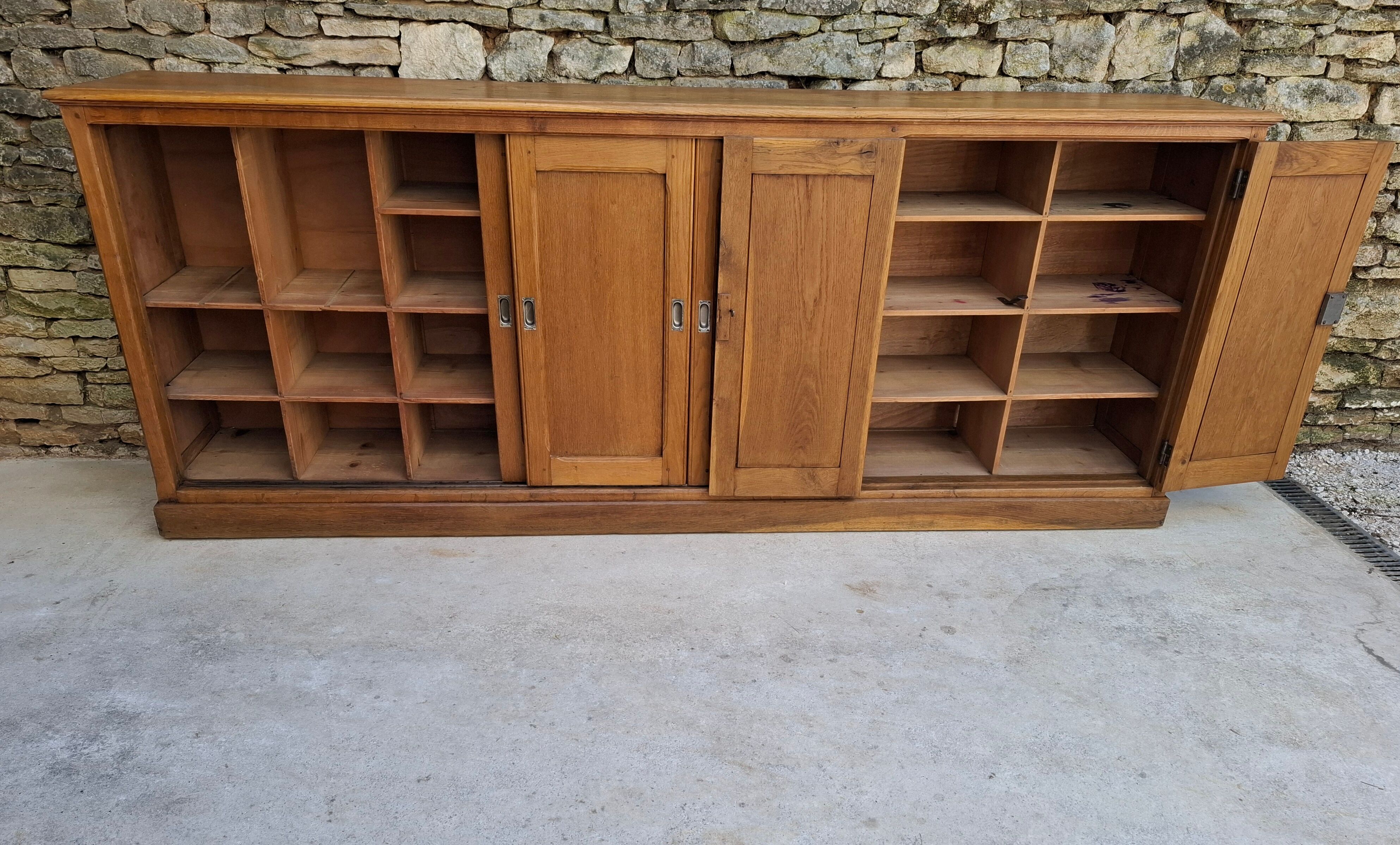 Oak workshop furniture with sliding doors.