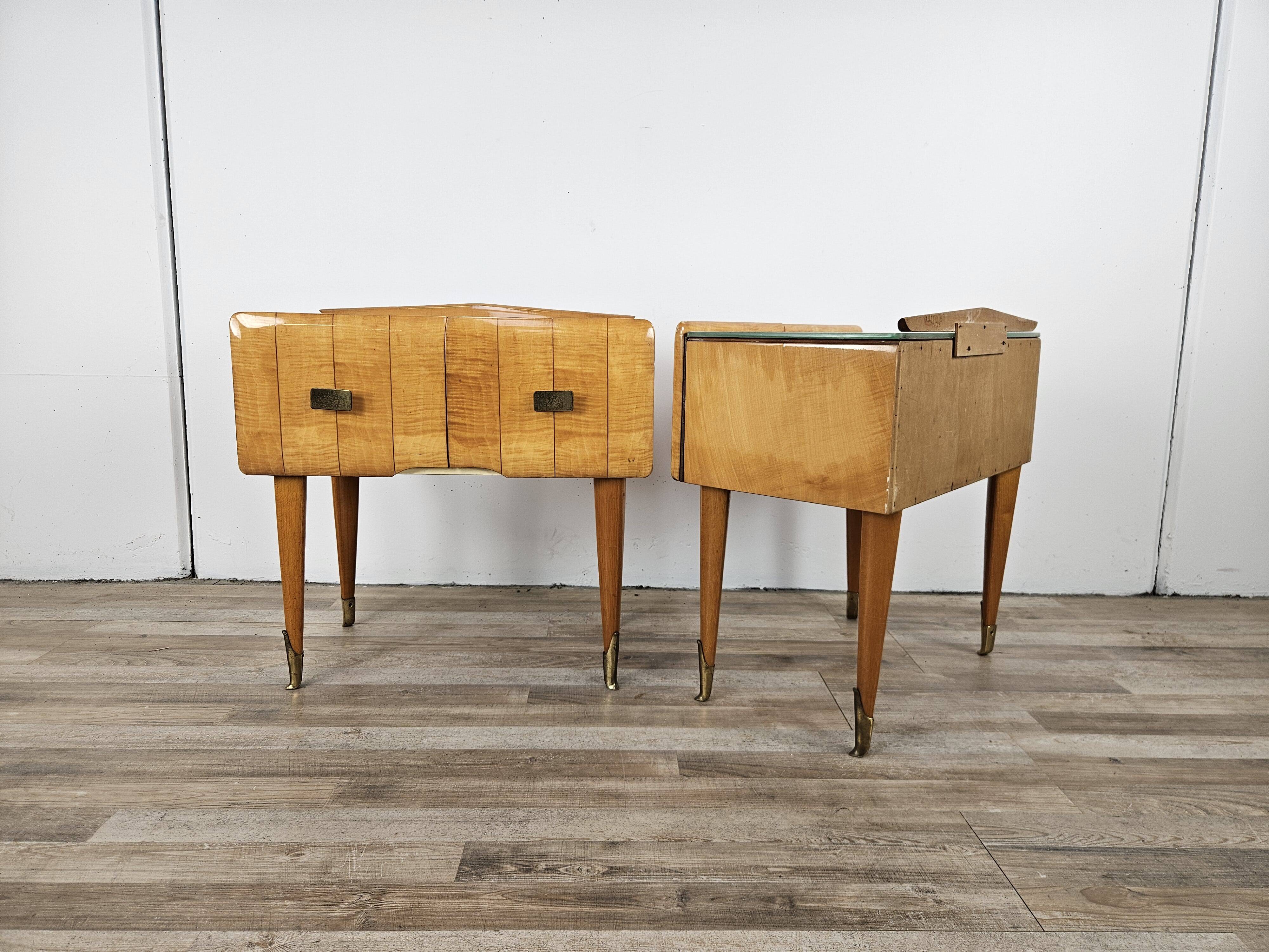 Mid-century nightstands in maple, brass, and glass